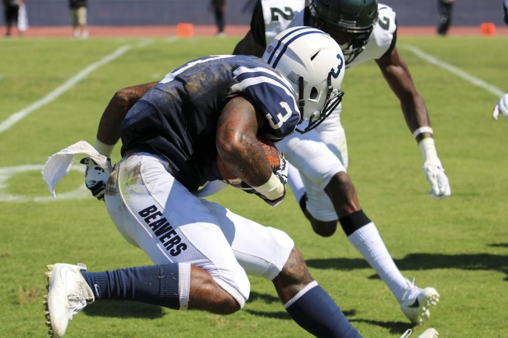 American River College wide receiver Eric Davis Jr. attempts to maneuver around a Laney College defensive back to gain more yards. ARC won 15-10 against Laney College on Sept. 14, 2019. (Photo by Emily Mello)