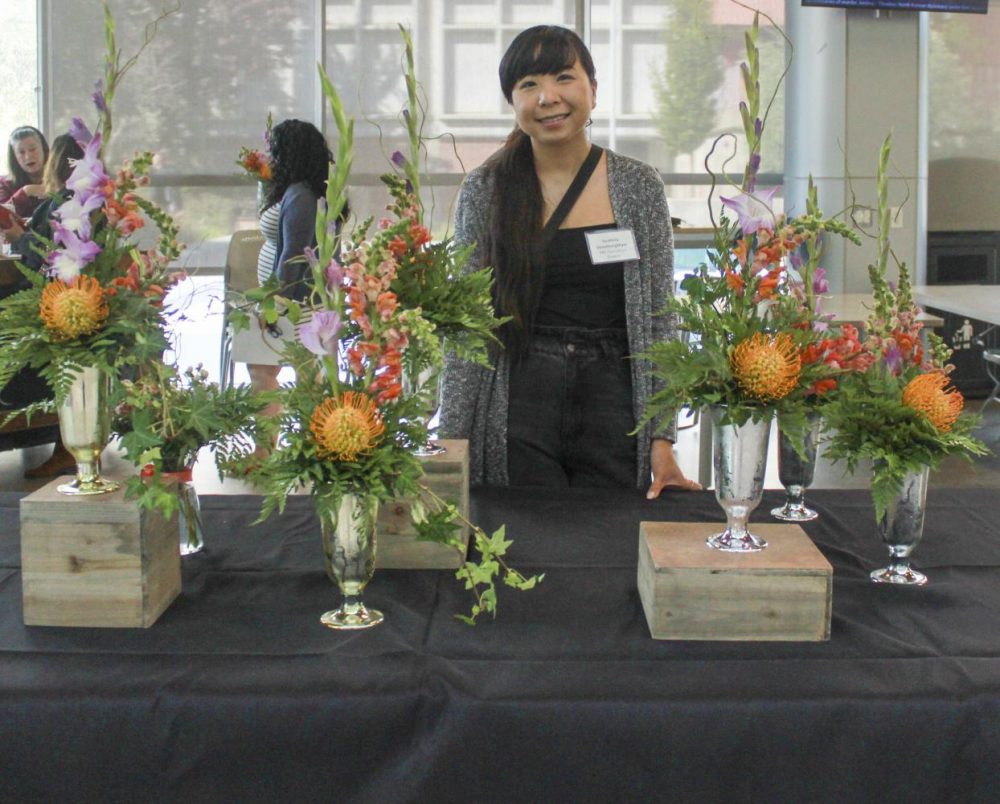 Floriculture student Southida Venethongkham sells flowers in the Student Center at American River College on Sept. 19, 2019. (Photo by Marquala Brown)