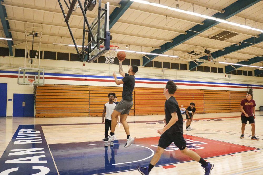 History major Javier Garcia shoots a lay-up during Team Activities class in the gym at American River College on Sept. 26 , 2019. (Photo by Emily Mello) 
