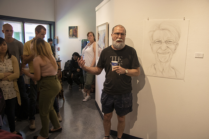 Craig Smith speaks about his artwork at the reception for the fall faculty art show at the James Kaneko Art Gallery American River College on Sept. 4, 2019. (Photo by Colin Bartley)