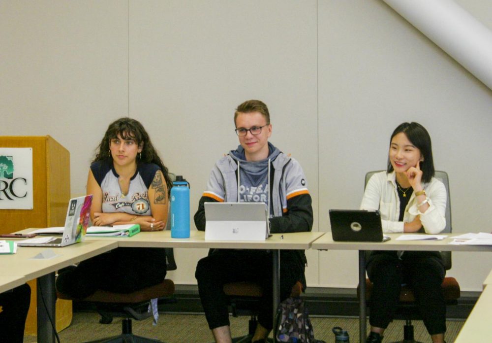 (From left to right) Senator Desireé Rodriguez, Jacob Couch and Fang Liu listen before voting on Bill F19-XX, which will reallocate $15,000 for the Senate registration,  at American River College on Oct. 11, 2019.
