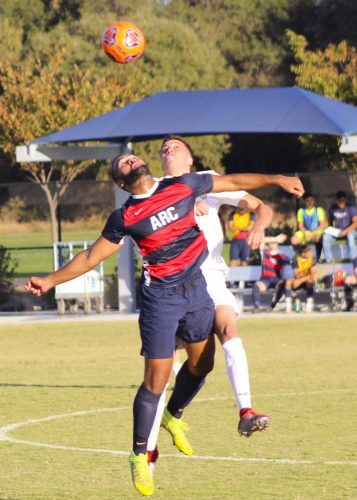 Forward Jonas Babel-Buckner fights for the ball in a game against Butte College on Oct. 18, 2019 at American River College. ARC lost the game 2-0. (Photo by Josh Ghiorso)