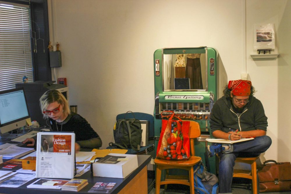 Fine arts major Jade Jacobs (left) and Dante Lewis Jr. work in the  James Kaneko Art Gallery at American River College on Oct. 21, 2019. (Photo by Josh Ghiorso)