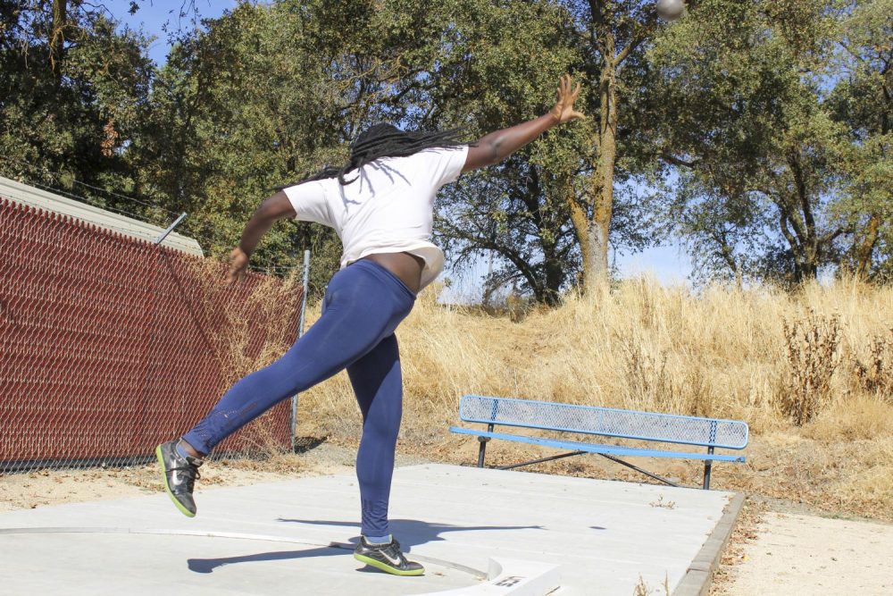 Psychology major Amarachukwu Ohia practices shot put in her track and field class at American River College on Oct. 22, 2019.