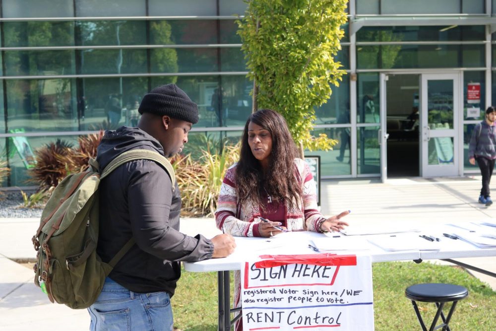  Undecided major Jonny Williams registers to vote at booth in front of the Student Center at American River College on Oct.16, 2019 (Photo by Josh Ghiorso)

