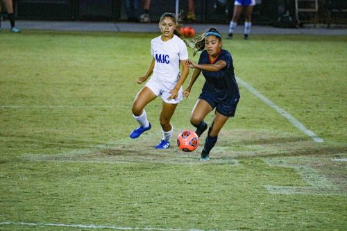 Midfielder Kelly Ortega dribbles the ball downfield in a win against Modesto City College on Oct. 15, 2019 at American River College (Photo by Bram Martinez). 