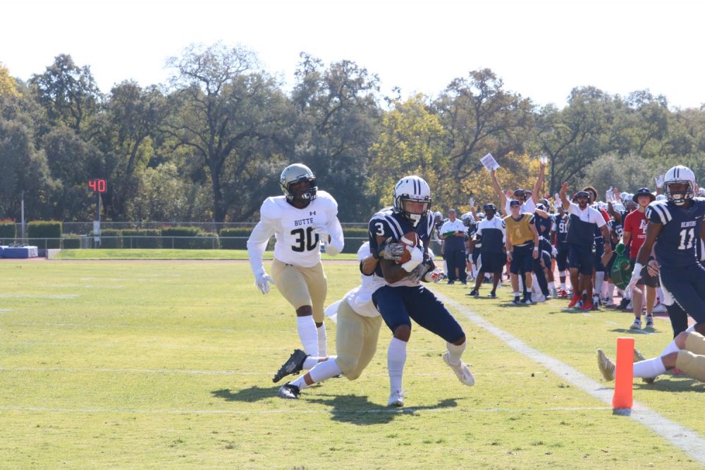 American River College wide receiver, Eric Davis Jr. fights his way into the end zone to score a touchdown for his team on Nov. 2, 2019. ARC won the game 14-7. (Photo by Brandon Zamora)