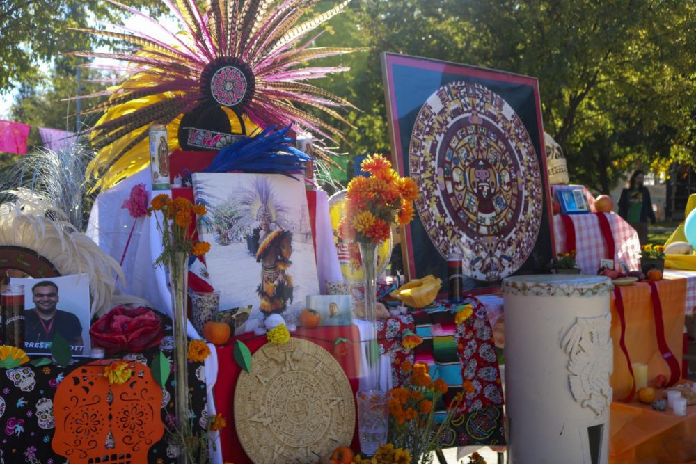 Latinos Unidos club set up a Dia De Los Muertos shrine which honors the dead, in front of the Student Center at American River College on Nov. 5, 2019 (Photo by Colin Bartley)