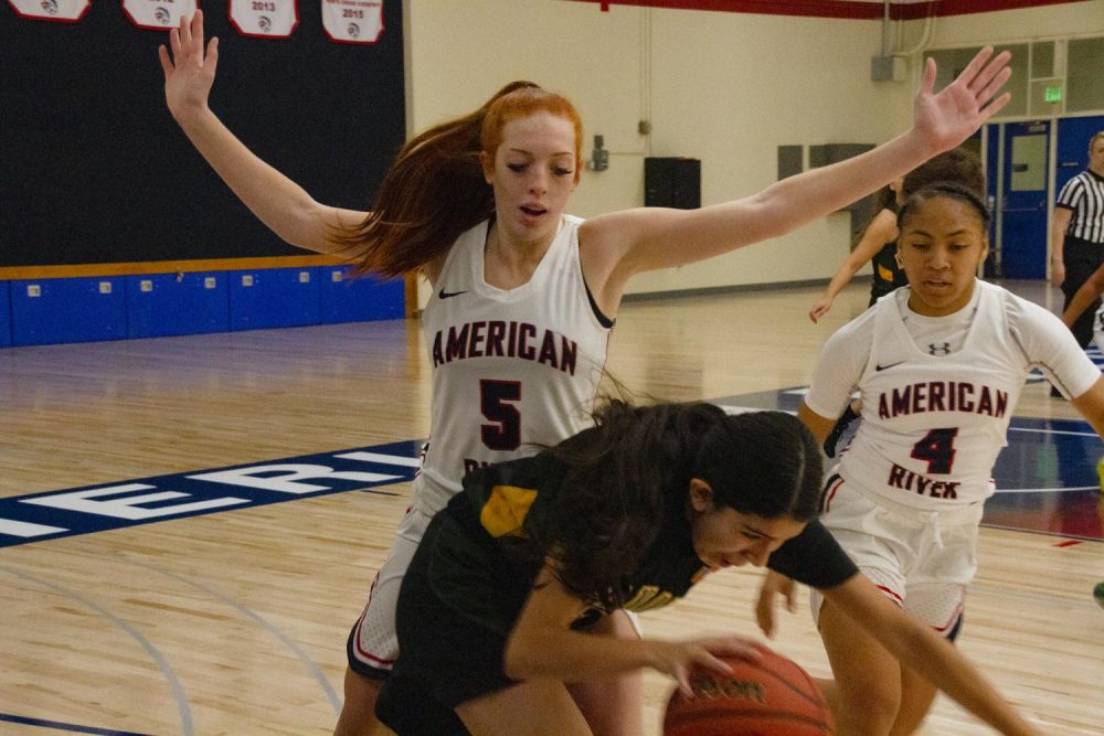 American River college starter Kaitlyn Janese (left) blocks a Napa Valley player in their first game of the season at ARC on Nov. 14, 2019. ARC won the opener 89 - 4. (Photo by Jennah Booth)