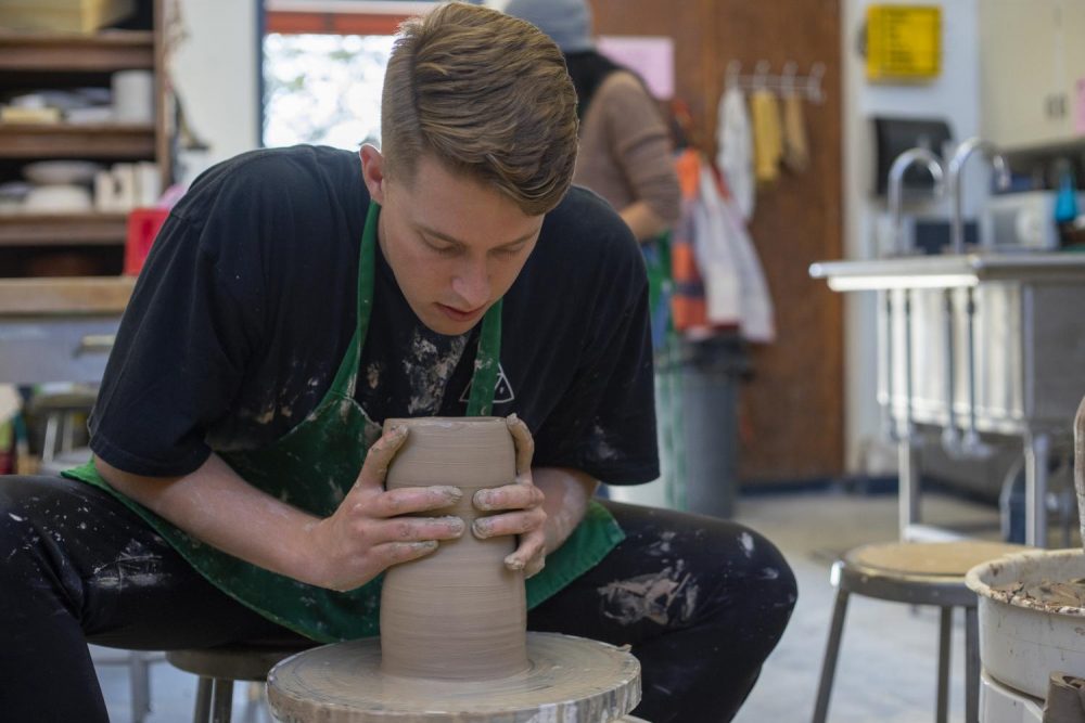 “I’m a business major but I enjoy art on the side,” Ryan Nelson said as he worked with a pottery wheel on Nov. 21, 2019. (Photo by Jack Harris)
