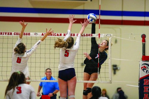 Zoe Zimmerman, freshman outside hitter, blocks the ball during a game against Folsom Lake College that earn the team a spot in the California Community College Athletic Association’s 2019 Womens Volleyball Championship at American River College on Nov. 30, 2019. 

