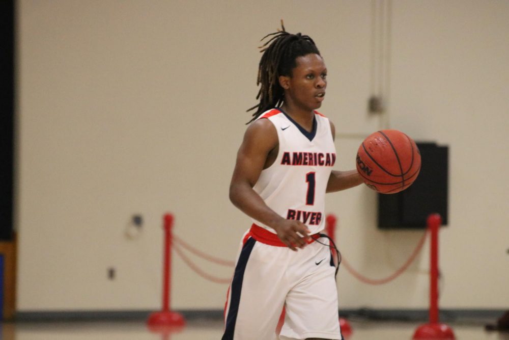 American River College guard Jair Lang dribbles the ball downcourt in a loss versus Cosumnes River College at ARC on Jan. 31, 2020. (Photo by Thomas Cathey)