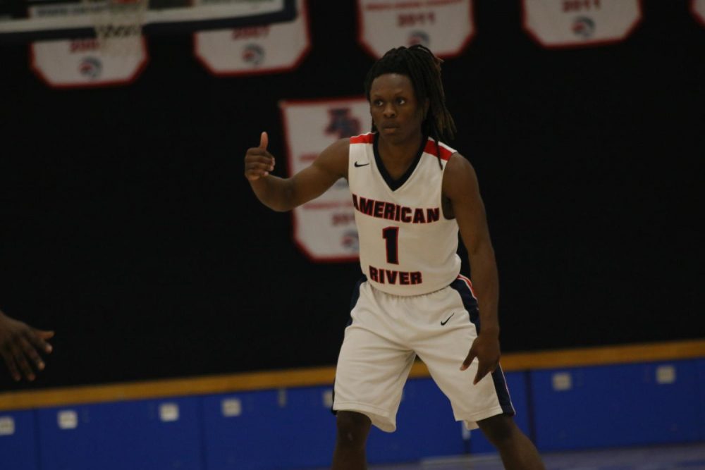 American River guard Jair Lang directs the offense in a game against San Joaquin Delta College on February 11, 2020. (Photo by Heather Amberson)