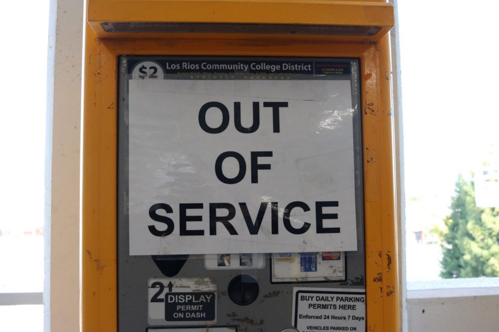 A parking meter on the fourth floor of the parking garage at American River College displays an “out of service” sign during the spring semester. (Photo by Emily Mello)