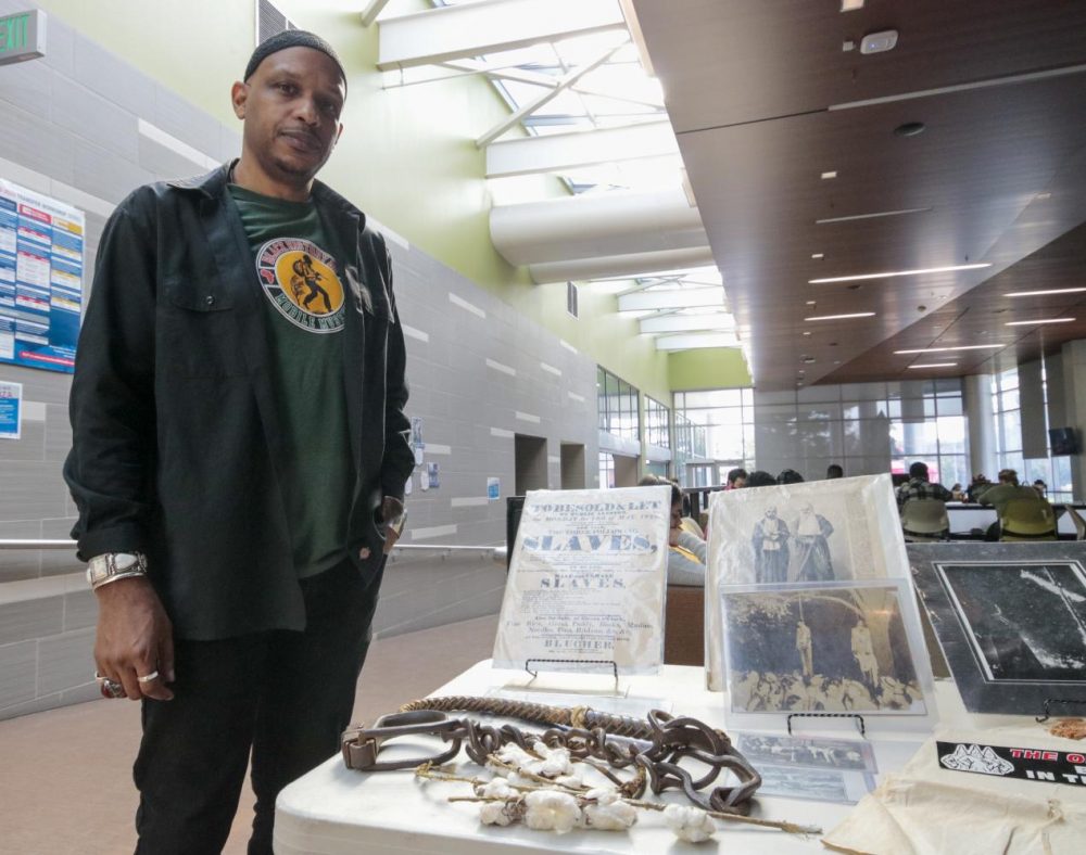 Khalid El - Hakim is the founder and curator of the Black History 101 mobile museum. He has been traveling all over the U.S and exposed the artifacts at the Student Center at American River College on Feb.13 , 2020. (Photo by Emily Mello)