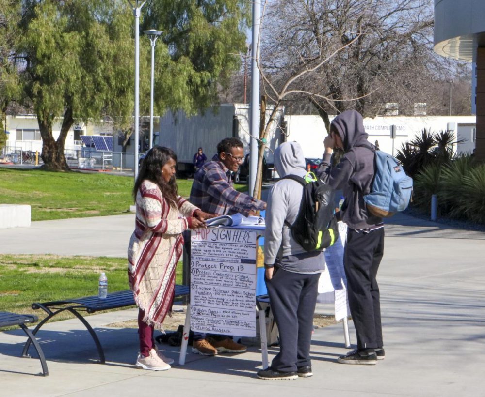 Petitioners gathering students signature outside of the student center at American River College campus on Jan. 30, 2020.(Photo by Clifton Bullock)
