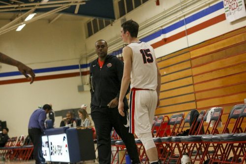 ARC men’s basketball assistant coach Kenny Thomas talks to ARC forward David O’Looney during the game against San Joaquin Delta on Feb. 11.  (Photo by Heather Amberson)