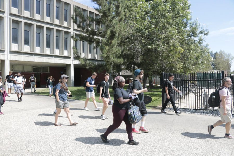 Students travel to classes between Davies Hall and the portable village on Sept. 5, 2019. There is a chance that there can be a return to campus for the fall 2021 semester. Student and faculty listening sessions and reopening reports are among the steps that will determine a possible reopening. (File Photo)