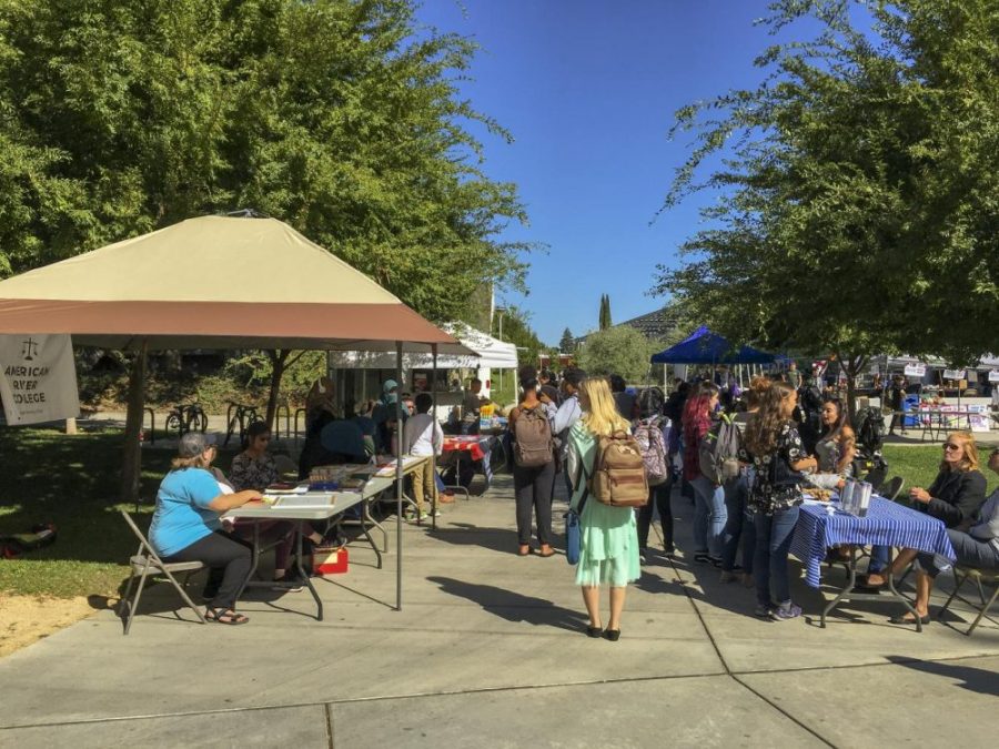 Students browse the booths near the Student Center on Welcome Day at American River College on Sept. 13, 2018. In an email sent by LRCCD Chancellor Brian King on May 3, the LRCCD plans to have a full return to campuses in spring 2022. (File Photo)