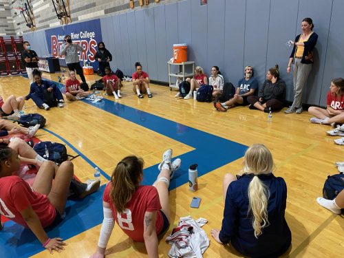 The American River College women’s volleyball team and Head Coach Carson Lowden discuss the game after its match with Sacramento City College on the ARC court, on Oct. 16, 2021. (Photo by Usamah Hammour)