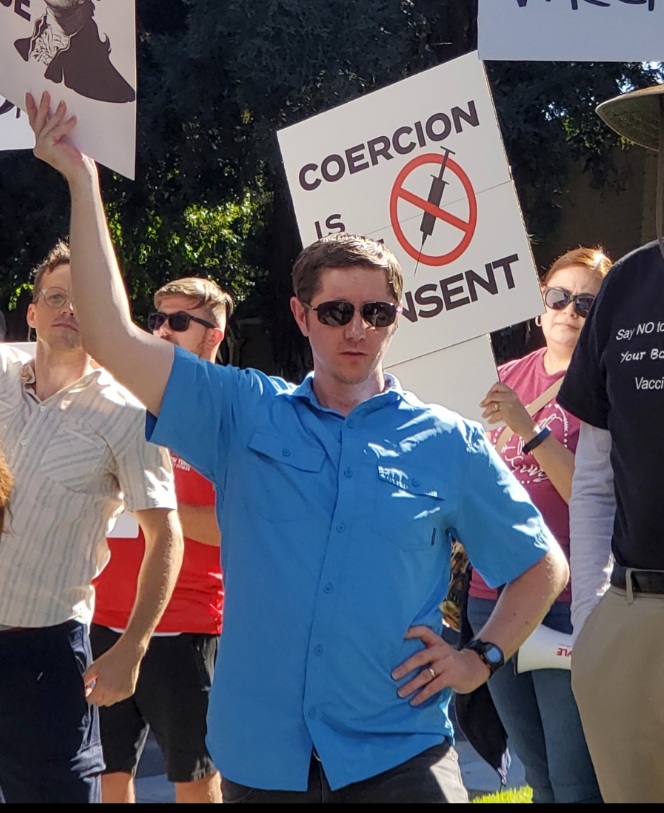 At a protest held at American River College on Jan. 26, Ryan Nix, ARC health services assistant, said he had tested positive for COVID-19 in the beginning of January. Nix, pictured here at a protest held at the Los Rios Community College District’s office on Sept. 30, 2021, is unvaccinated but says he was still allowed to work on campus three days a week. (Photo by Lorraine Barron)