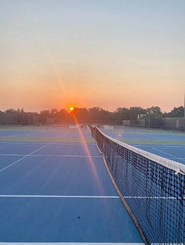 The beautiful red sunrise over American River Colleges tennis courts. (Photo by Carla Montaruli)