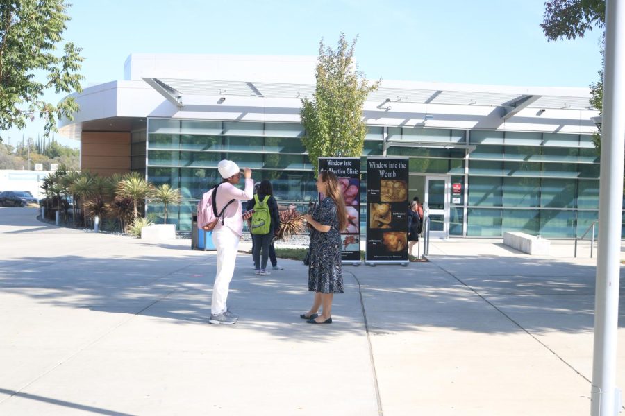 Abortion protesters display posters near the library and Student Center at American River College on Oct. 17 and 18. (Photo by Lorraine Barron)