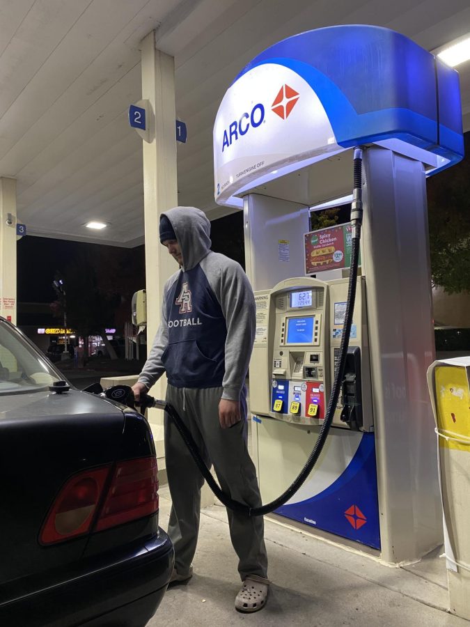 An American River College student gets gas after a day of school on Nov. 9. With gas prices high, students and staff attending ARC have to alter their daily habits. (Photo by Carla Montaruli)
