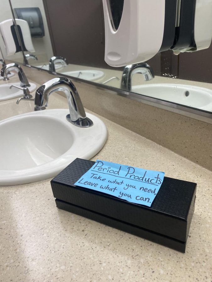 Someone initiated a shared feminine product basket in one of the womens bathrooms in the Student Center (Photo by Carla Montaruli)
