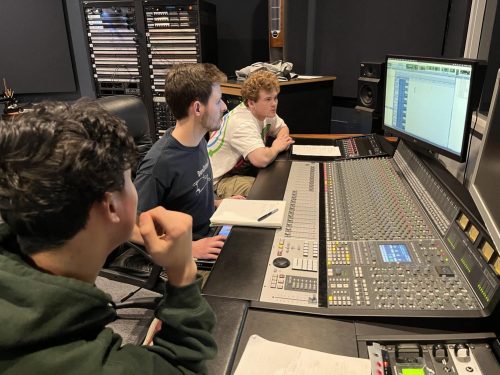 Kinzang Gyeltshen, Parker Weis and Emerson Myers (from left to right), students in the advanced recording studio techniques class, work in Studio A. (Photo courtesy of the ARC Commercial Music Department)