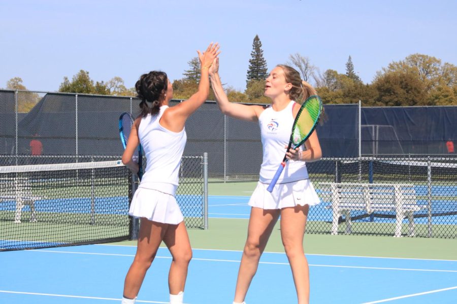 American River College women’s tennis faced Folsom Lake College on April 5 with ARC coming out as the victor in the Big 8 Conference. Bella Hernandez and Laney Reddick celebrate winning a match against FLC. (Photo by Katie Vance)