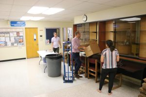 Davies Hall will close on Sept. 8, and classes normally held there will be moved online until new spaces are found, according to a statement sent to students, staff and faculty. Faculty and staff packing up offices in Davies Hall on Sept. 7. (Photo by Shy Bell)