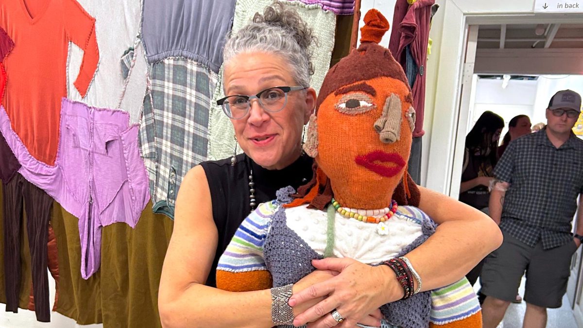 Linda Gelfman, an art professor at American River College, poses with one of her sculptures at her recent exhibition. (Photo courtesy of Linda Gelfman)