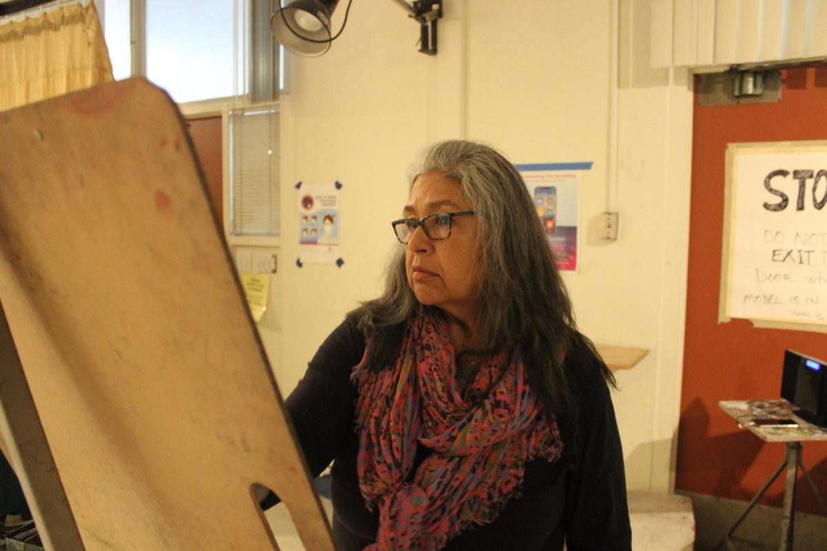 Sarah Mattson, an art professor at American River College, working on her figure drawing on March 1, 2024. (Photo by Chris Johnson)