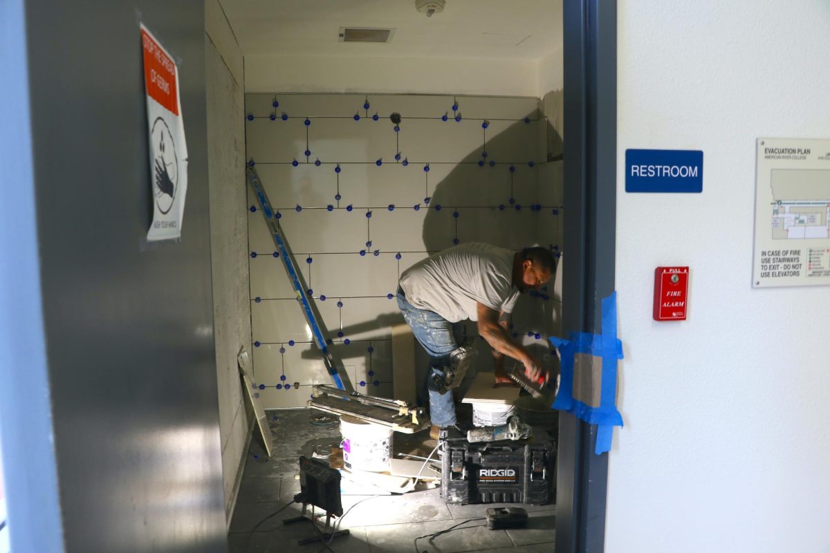 Jose Ramirez, a construction worker, works on the restroom in the American River College lower library on March 28, 2024. (Photo by Elisha Chandra)