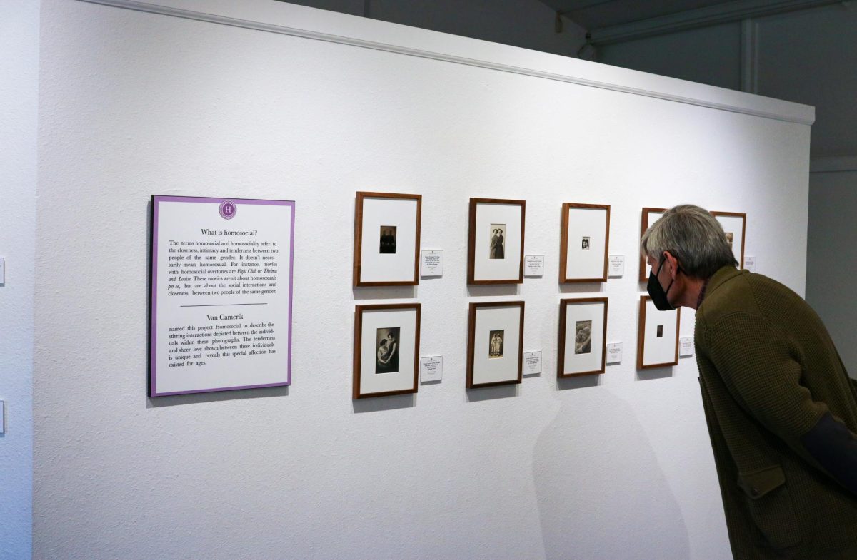 A patron of the Kaneko Gallery studies the art during the “Homosocial” exhibition on May 2, 2024. (Photo by Shy Bell)