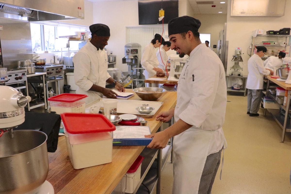 Jesus Miranda (right) and Troy Bernard (left) prepare to make sourdough in Hospitality Management class 326 on April 4, 2024. (Photo by Jose Leon)