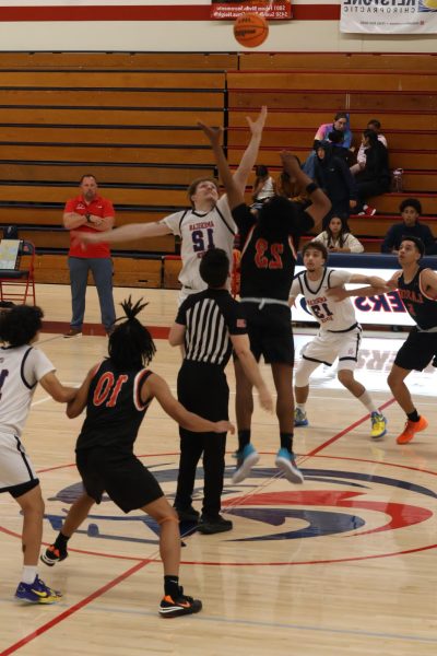Sam Herlehey jumps for the opening tip inside Hutchison Gym as ARC begins its ARC Classic matchup with Lassen. (Photo by Marquis Martin)
