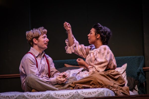 Christopher Wirth and Alexandria Wilson as Herman and Julia, exchanging gifts for their 10th anniversary. (Photo by Andrew Fiffick)
